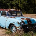 Blue tarps and rusting cars can be a part of the rural landscape